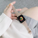 Apple Watch with double lines steel replacement strap, showcasing vibrant watch face on wrist.