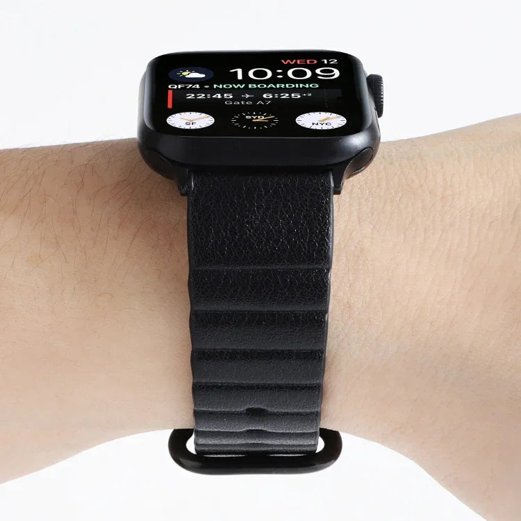 Apple Watch replacement strap on wrist showing stylish leather design and easy adjustability for comfort.