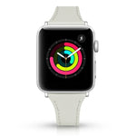 Leather replacement strap for Apple Watch in light grey on a smartwatch display with colorful activity rings.