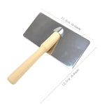 Manual pet grooming brush with wood handle and soft curved bristles for effective shedding removal.